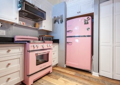 retro kitchen white shaker cabinets pink stove retro 1950