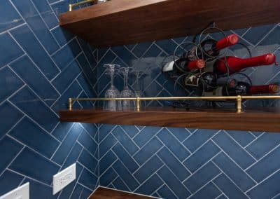 dry bar floatings shelves and herringbone blue tile