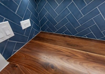 walnut butcher block with blue herringbone tile