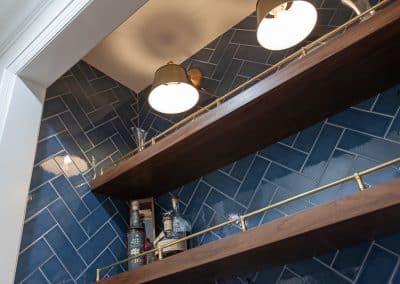 dry bar floatings shelves and herringbone blue tile