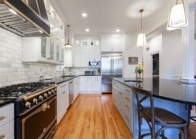 kitchen refinish and reface chicago, illinois bm swiss coffee, transitional style, shaker doors, black range and hood with gold accents