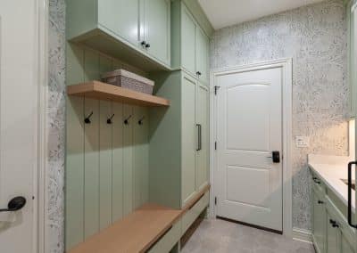 custom mudroom cabinetry in elmhurst illinois rift sawn white oak bench and shelf with sw softened green finish